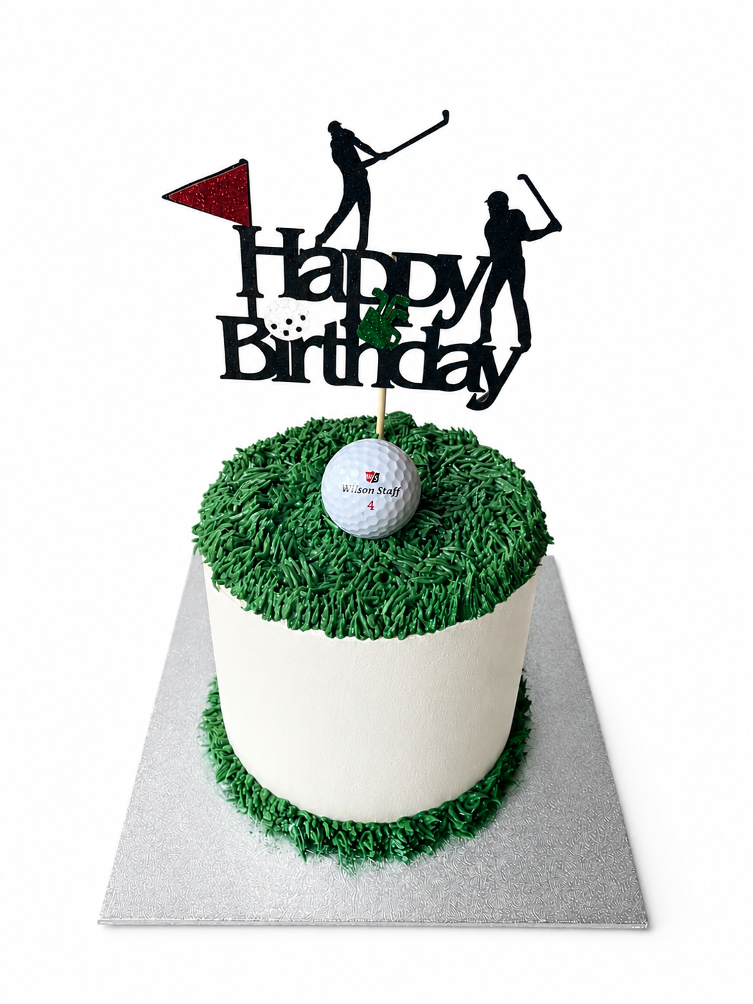 Golf themed birthday cake with piped green grass and a golf ball topper