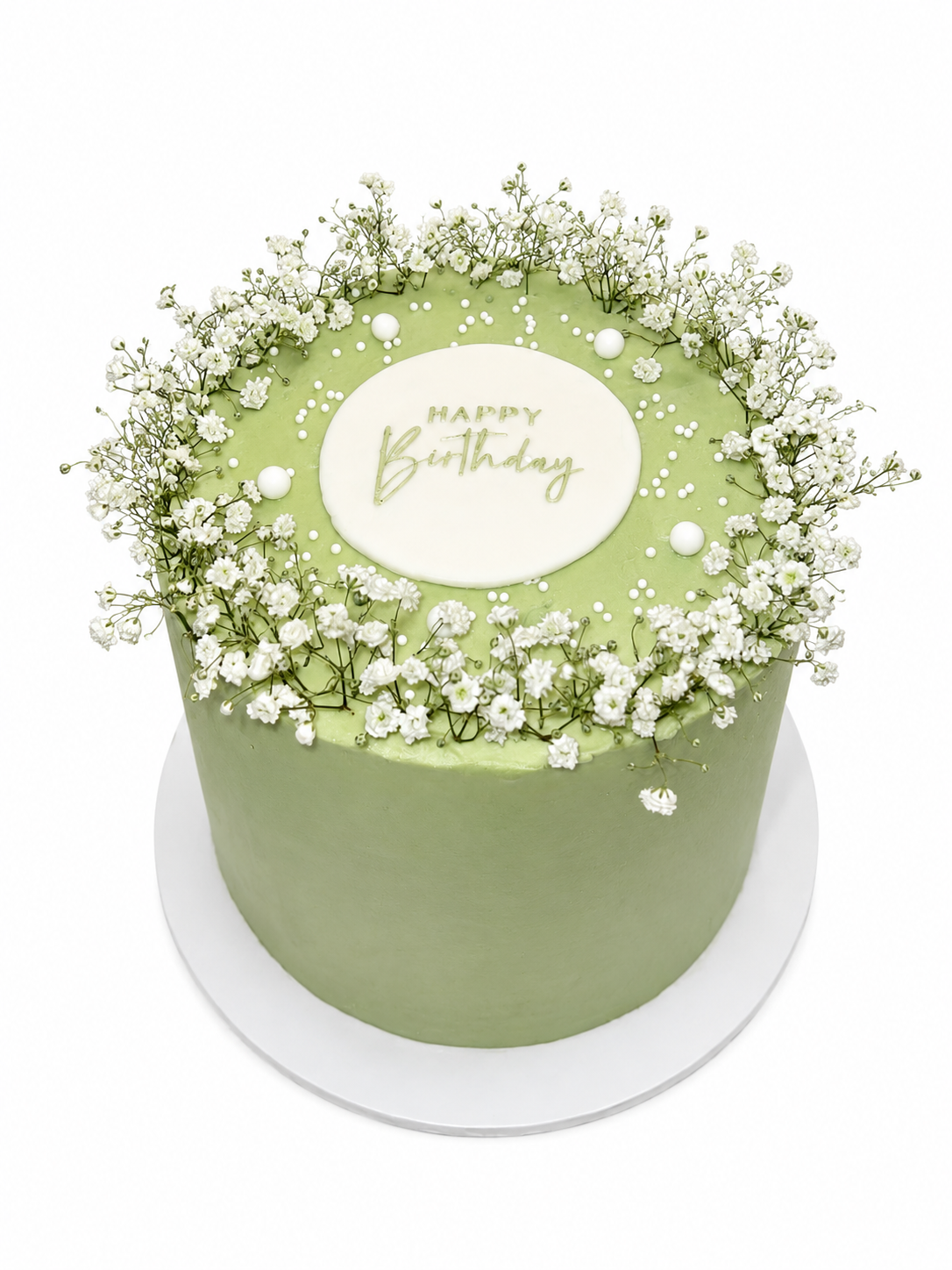 A sage green celebration cake finished with white gypsophila