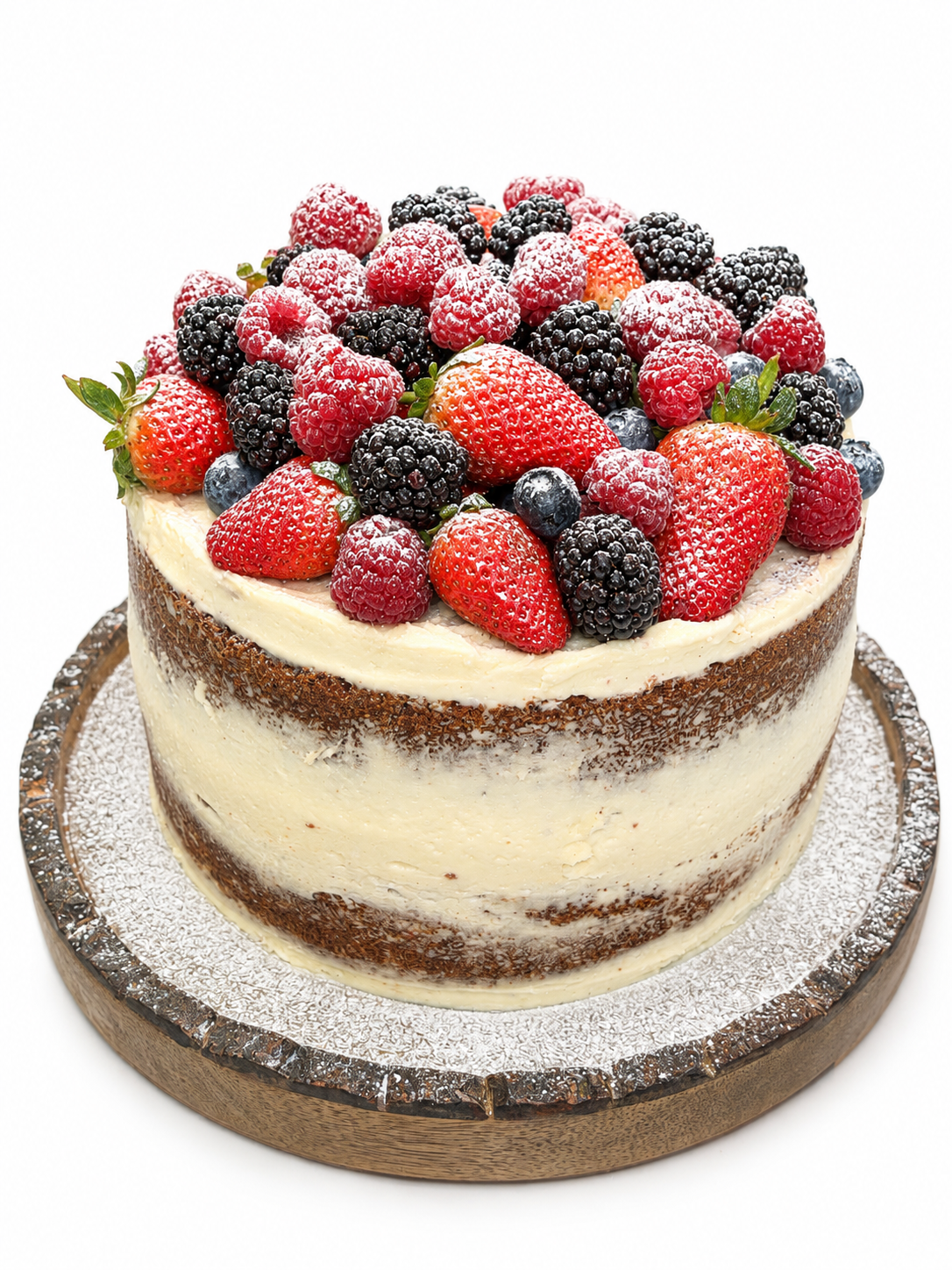 Naked sponge cake topped with fresh strawberries, raspberries, blackberries and blueberries